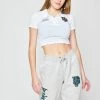 BROKEN PROMISES Poor Sport Cropped Polo Top Womens